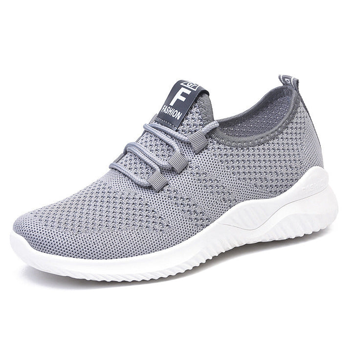 Tył wygodnych sneakersów unisex z dzianinową cholewką