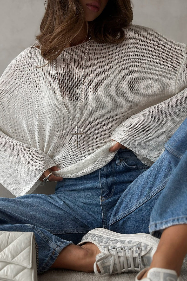 Damski sweter o luźnym kroju z efektownym ażurowym splotem