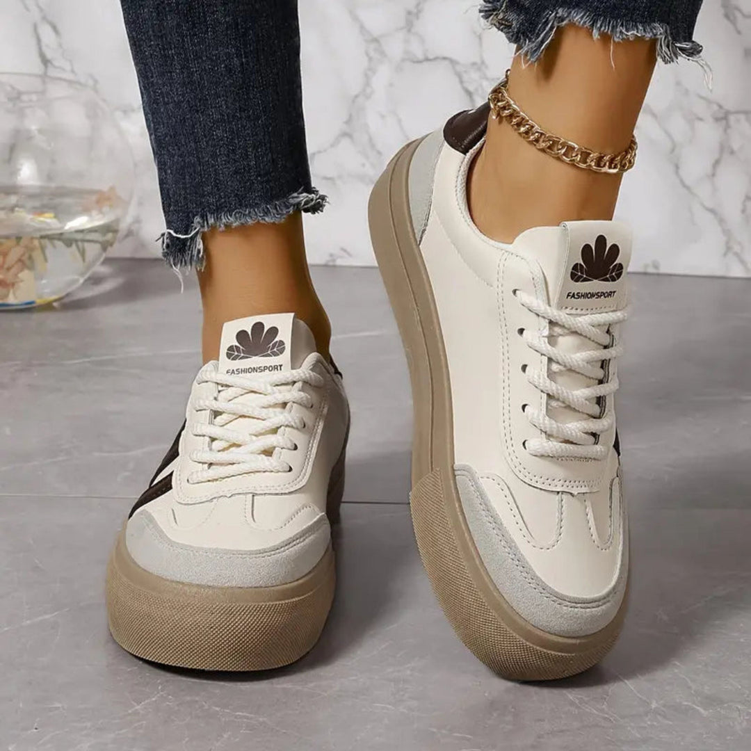 Widok z boku białych damskich sneakersów w stylu retro